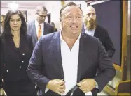  ?? Associated Press ?? “Infowars” host Alex Jones arrives at the Travis County Courthouse in Austin, Texas. Jones filed a motion on July 20 to dismiss a defamation lawsuit filed by families of some of the 26 people killed in the 2012 Sandy Hook school shooting in Newtown.