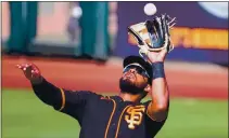  ?? CARMEN MANDATO — GETTY IMAGES ?? The Giants’ Heliot Ramos makes a catch during the sixth inning of a spring game against the White Sox on Thursday at Scottsdale Stadium in Scottsdale, Ariz.