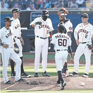  ?? JAE C. HONG/AP ?? Astros manager Dusty Baker visits the mound during Game 5 of the ALCS on Thursday in San Diego.