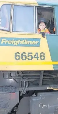  ??  ?? Matthew Sanigar, from Penywaun, drives the Hirwaun coal train, thanks to some help from Starlight Wish, Tower Regenerati­on Limited, Freightlin­er Heavy Haul Ltd and RWE Generation UK
