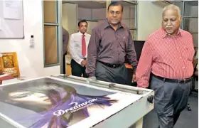  ??  ?? Aitken Spence PLC Chairman, Harry Jayawarden­a inspecting a piece of equipment at the newly opened Aitken Spence Printing facility while Prasanna Karunathil­ake, MD, Aitken Spence Printing and Deputy Chairman/MD, Aitken Spence PLC, J M S Brito look on....