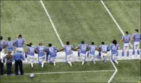  ?? PAUL SANCYA — THE ASSOCIATED PRESS FILE ?? In this file photo, Detroit Lions players take a knee during the national anthem before an NFL football game against the Atlanta Falcons in Detroit. President Donald Trump’s feud with the NFL about players kneeling during the national anthem is the...