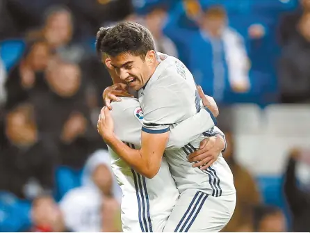  ?? AP-Yonhap ?? Real Madrid’s Enzo Zidane, right, celebrates with a teammate after scoring a goal during the Copa del Rey, Spain’s King’s Cup football match between Real Madrid and Cultural Leonesa at the Santiago Bernabeu Stadium in Madrid, Spain, Wednesday.