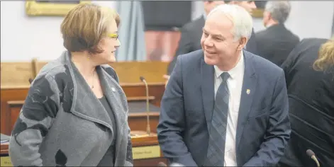  ?? MITCH MACDONALD/THE GUARDIAN ?? Green Party Leader Peter Bevan-Baker, right, chats with Green MLA Hannah Bell before question period. Last week, Bevan-Baker said the province’s carbon reduction plan would only subsidize fossil fuel use rather than provide an incentive to reduce it.