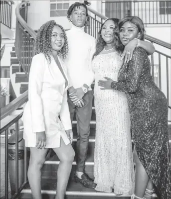  ?? ?? Police Constable Annette Abel (second from right) and her three children on her wedding day