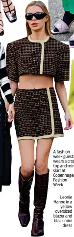  ?? ?? A fashion week guests wears a crop top and mini skirt at Copenhagen Fashion Week