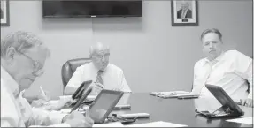  ?? Keith Bryant/The Weekly Vista ?? Alderman John Flynn, left, sits during the council’s work session, along with mayor Peter Christie and staff attorney Jason Kelley.