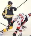  ?? STAFF PHOTO BY STUART CAHILL ?? CHECKED: Drew Stafford collides with Ottawa’s Alex Burrows.