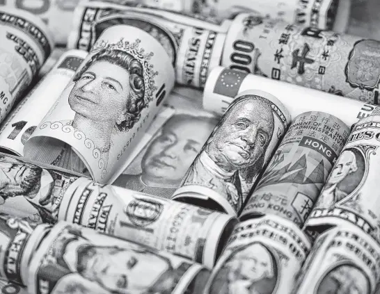  ?? REUTERS ?? Euro, Hong Kong dollar, U.S. dollar, Japanese yen, British pound and Chinese 100-yuan banknotes are seen.
