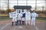  ?? PERK SCHOOL ATHLETICS ?? Perkiomen School baseball coach Ken Baker, center, poses with his players after winning his 500th game against Quakertown on Friday.