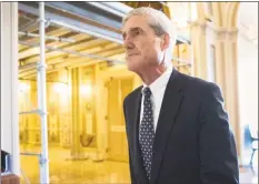  ?? J. Scott Applewhite / Associated Press ?? In this June 21, 2017 file photo, special counsel Robert Mueller departs after a meeting on Capitol Hill in Washington, D.C. A redacted version of Mueller's Russia report was released on Thursday.