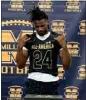  ?? PHOTO BY JOHN W. DAVIS ?? Millikan's Ryan Pellum tries on his Under Armour Next All-American Game jersey.