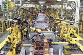  ?? CARLOS OSORIO/AP ?? Ford says it wants to reopen five North American assembly plants, closed because of the coronaviru­s epidemic, in April. The UAW is reviewing the announceme­nt carefully.