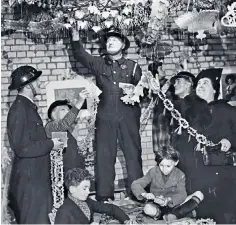  ??  ?? Nerves of steel and a cheerful dispositio­n: Mildred Schutz, below. Members of the ARP organising a service in 1940, above