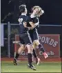  ??  ?? Boyertown’s Landon Wenger, right, celebrates with Nick Willson (17) after scoring a goal in the second half against Owen J. Roberts.