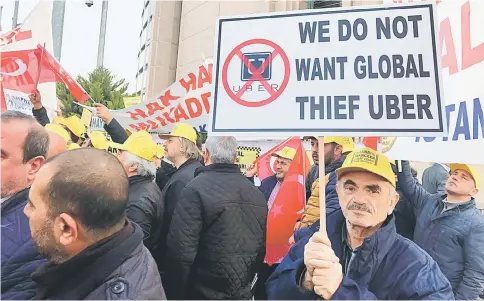  ??  ?? Hundreds of Turkish cab operators and drivers protest against Uber in front of Istanbul Courthouse on Mar 12. — WP-Bloomberg photo