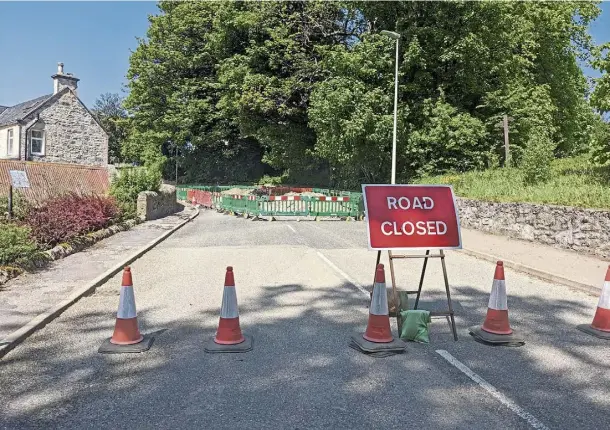  ?? ?? NO ENTRY: Fife Street in Dufftown is blocked off for repairs to a collapsed sewer pipe, which undermined the surface and created a sinkhole.