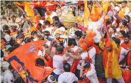  ?? — PTI ?? Devotees participat­e in a religious procession on the occasion of Hanuman Jayanti at Jahangirpu­ri in New Delhi on Tuesday.