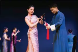  ??  ?? Young artists Xu Dani and Pan Wenlong perform in the Nanyin oratorio Ode to the Golden Stone.