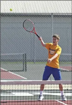  ?? Staff photo/John Zwez ?? A player for St. Marys hits a shot during Tuesday’s match at the Wapakoneta HS courts.