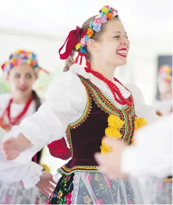  ?? DAX MELMER ?? Julia Kulesza, centre, and the Tatry Song and Dance Assemble perform to the song Krakowiak, a national dance of Poland, while at the Polish Festival on Friday during the opening evening of the Carrousel of Nations.