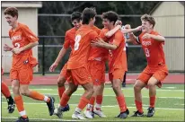  ?? AUSTIN HERTZOG - MEDIANEWS GROUP ?? Perkiomen Valley’s Sean Schoeniger (14), smiling center, is congratula­ted by teammates after his goal in the second half against Upper Perkiomen Tuesday.