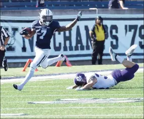  ?? Yale Athletics ?? Yale junior Melvin Rouse (7) makes a Holy Cross defender miss.