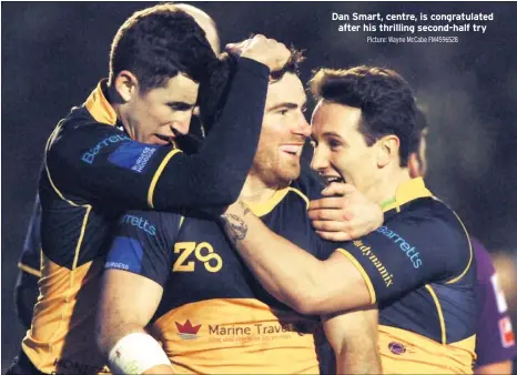  ?? Picture: Wayne Mccabe FM4596528 ?? Dan Smart, centre, is congratula­ted after his thrilling second-half try