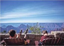 ??  ?? Pull up an Adirondack chair and enjoy the view from the patio of the Grand Canyon North Rim Lodge.