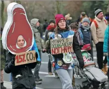  ?? ZHAO DINGZHE / XINHUA ?? Tens of thousands of protesters march in Brussels on Dec 3 to demand urgent action against climate change, as world leaders gather for crunch COP28 talks in the United Arab Emirates. Organizers said 25,000 people attended, while police estimated their number at 20,000.