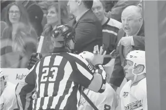  ?? DAVID ZALUBOWSKI/The Associated Press ?? Anaheim Ducks coach Bruce Boudreau, getting a caution from referee Brad Watson while arguing a call,
says his Game 7 coaching record hints that he hasn’t learned anything from the experience.