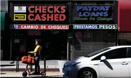  ?? Fallon/AFP/Getty Images ?? The Consumer Financial Protection Bureau will finalize a rule designed to cut ‘out of control’ late credit card fees. Photograph: Patrick T