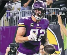  ?? Adam Bettcher/Getty Images ?? Kyle Rudolph of the Vikings celebrates a 15-yard touchdown in the fourth quarter Monday against the New Orleans Saints at U.S. Bank Stadium in Minneapoli­s.