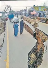  ?? PTI ?? A view of a damaged road after an earthquake rocked Pakistan-occupied Kashmir on Tuesday. The epicentre of the quake was Mirpur.