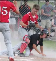  ?? Tim Conover ?? Broken Bow catcher Max Denson, pictured above, attempts to tag out the Chase County base runner at home plate but the ball comes out of the glove making the runner safe.