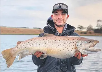  ??  ?? ABOVE: Chris Farrugia with the 5.1kg brown trout he caught from Lake Purrumbete. BELOW: Lachlan Sears, 9, with his first snapper from Corio Bay.