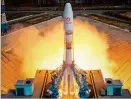  ??  ?? PROGRESS: A rocket booster with satellites blasts off from the Vostochny Cosmodrome