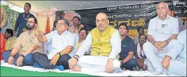  ?? PTI ?? BJP president Amit Shah (centre), party’s Karnataka CM candidate BS Yeddyurapp­a (right) and other party leaders sit on a daylong fast in Dharwad, Karnataka, on Thursday.