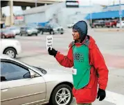  ?? BECKEL, THE OKLAHOMAN] [PHOTO BY JIM ?? Frank Gibbs sells the Curbside Chronicle at the intersecti­on of NW 23 and Broadway on Tuesday.