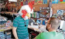  ?? [PHOTO PROVIDED] ?? Guestroom Records owners Justin Sowers (left, in chicken head) and Travis Searle.