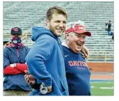  ?? DAVID JABLONSKI/ STAFF ?? Adam Trautman shares laughs with Dayton football coach Rick Chamberlin on Saturday. The former Flyer, now with the Saints, spoke to the team after a scrimmage.