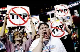  ?? JOHN LOCHER/AP ?? Backers of Bernie Sanders react during the Democratic National Convention on Monday.