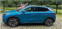  ?? Sjoerd Janssen via Associated Press ?? “I really, really love the car,” says Laima Springe-janssen, shown with her electric car from Chinese auto brand BYD.