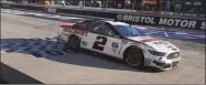  ?? Kevin C. Cox / Getty Images ?? Brad Keselowski cross the finish line to win at Bristol Motor Speedway on Sunday in Bristol, Tenn.