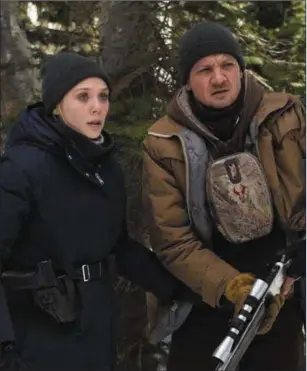  ??  ?? Elizabeth Olsen and Jeremy Renner in WindRiver.