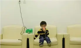  ??  ?? Hanhan, three, receives nebuliser therapy after a Beijing red alert for air pollution in 2015. Photograph: Jason Lee/Reuters