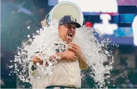  ?? Sam Hodde/Getty Images ?? Nathaniel Lowe had four hits, including one of the Rangers’ four home runs on Friday night in a come-from-behind rout of the Guardians in Arlington.