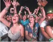  ??  ?? DJ Snake works up the crowd at the Empire Polo Club on Saturday at Coachella.