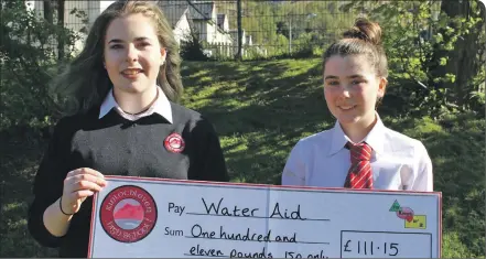 ??  ?? Naomi Hannah (S3) and Katie Higgins (S3) with the charity’s cheque.