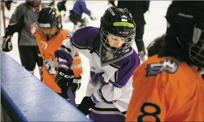  ?? Olivia Harlow/The New Mexican ?? Julia Doebling (8), center, participat­es in hockey drills during a recent practice at Santa Fe’s Genoveva Chavez Community Center. The New Mexico Mustangs are the state’s only independen­t girls hockey team.